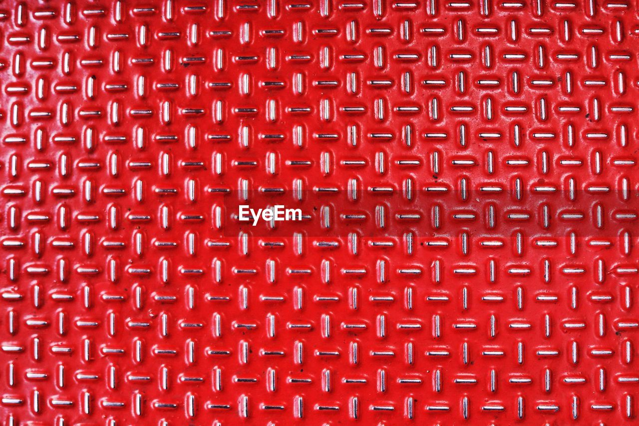 Full frame shot of red metal with pattern