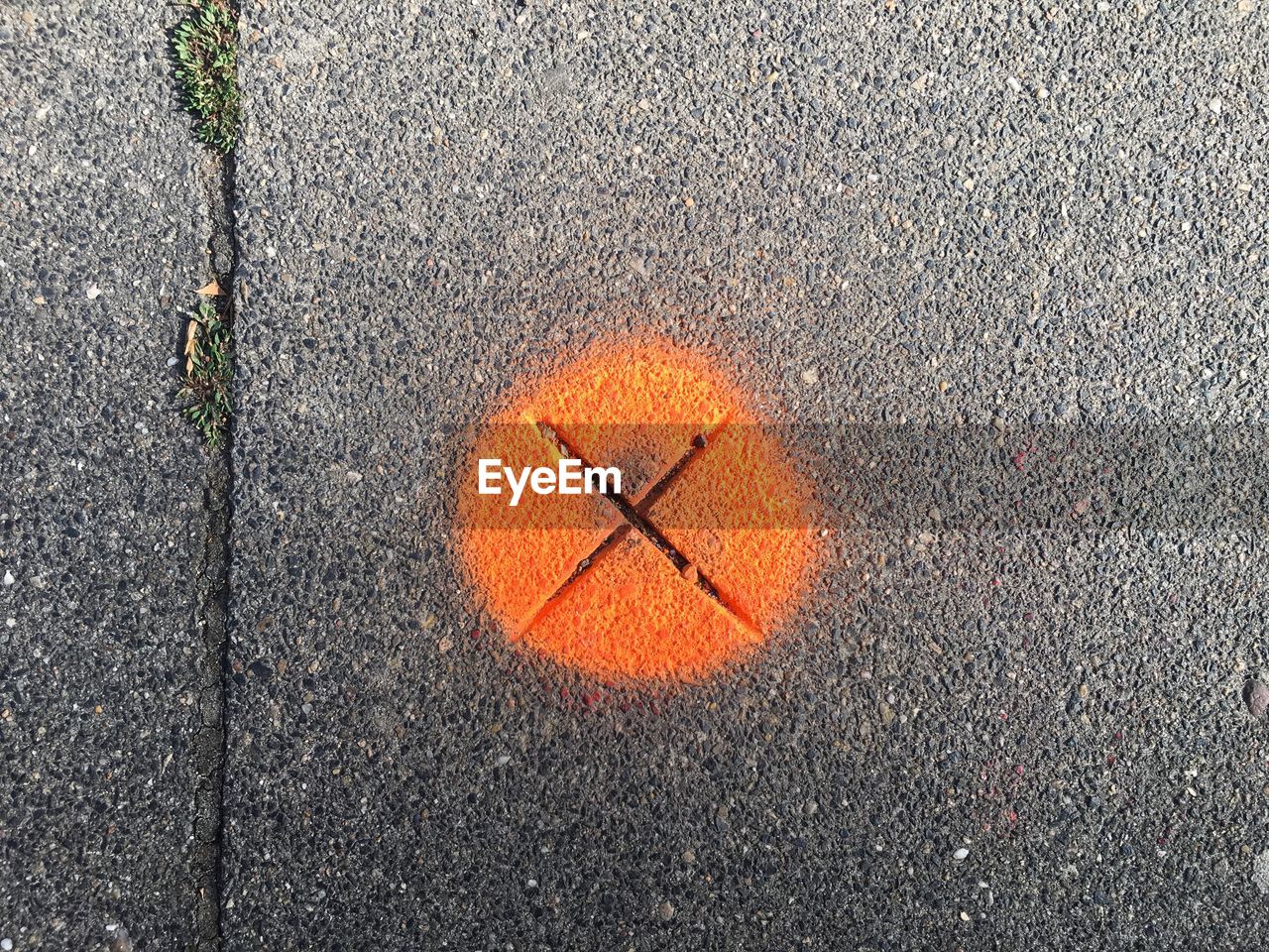 High angle view of arrow sign on road