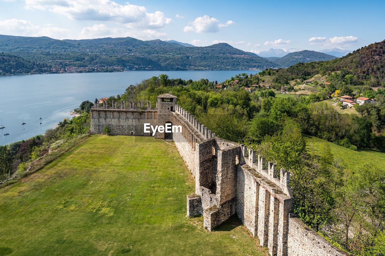View from the rocca di angera with the walls of the castle and the lake maggiore, italy
