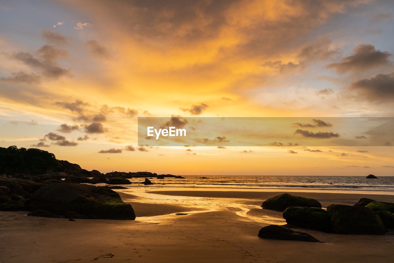 SCENIC VIEW OF SEA AGAINST ORANGE SKY