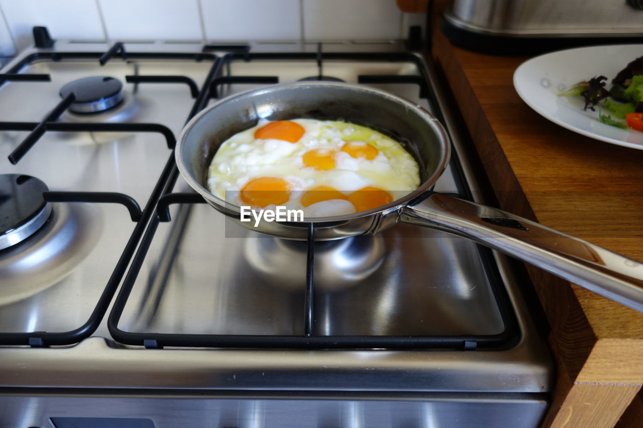 Fried egg in pan on stove
