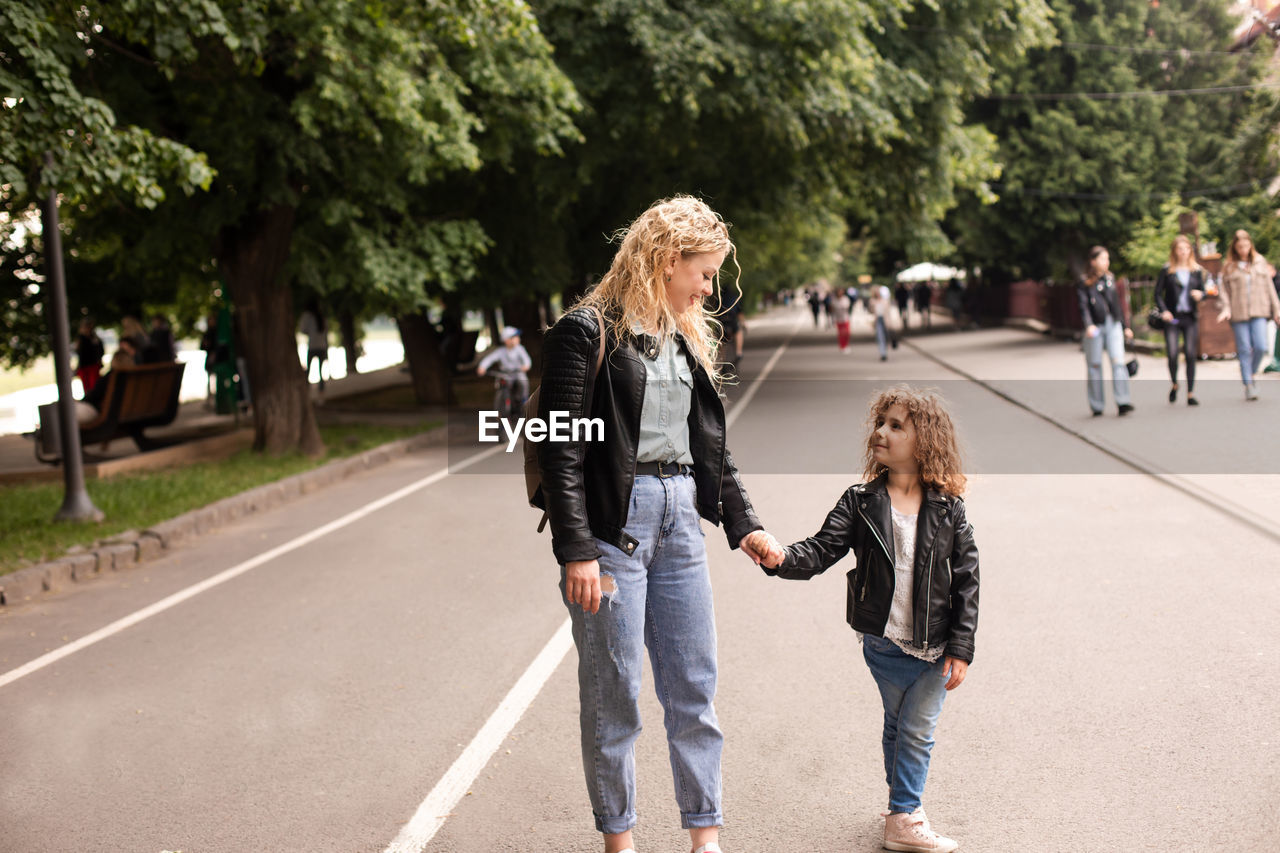 Women walking on street in city