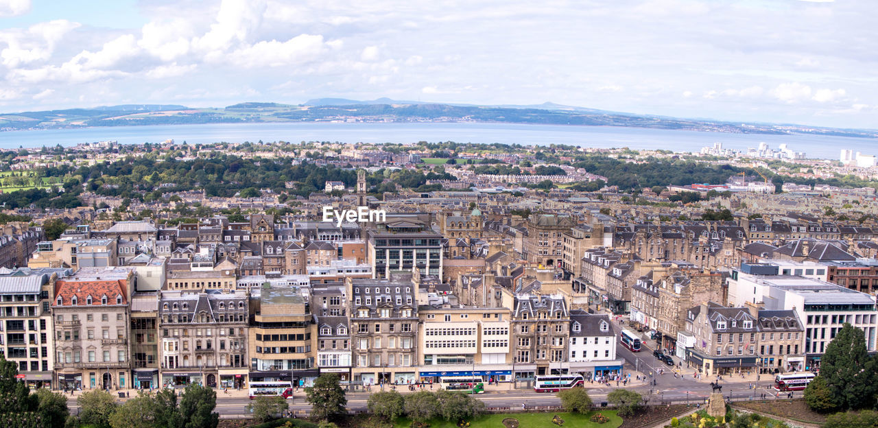 HIGH ANGLE VIEW OF TOWNSCAPE AND BUILDINGS AGAINST SKY