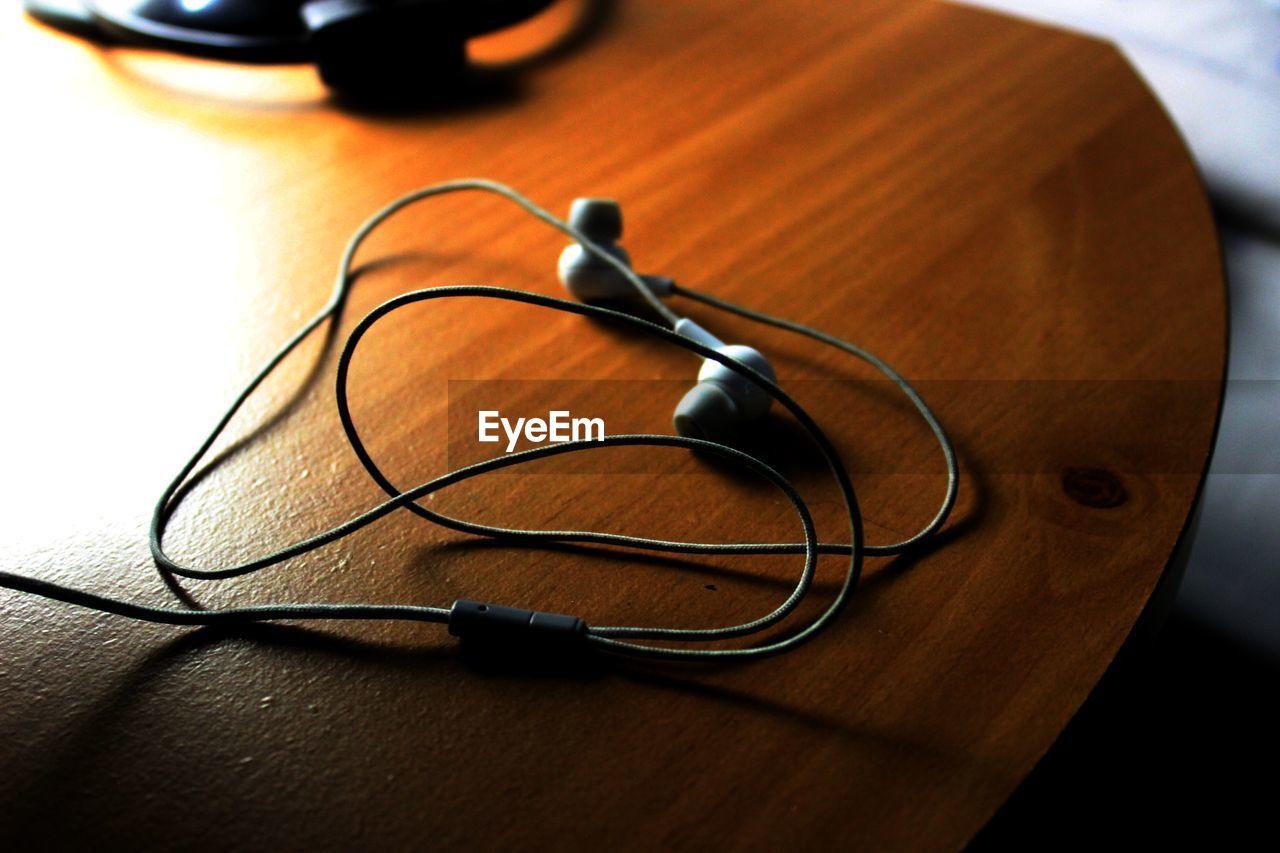 High angle view of earphones on table