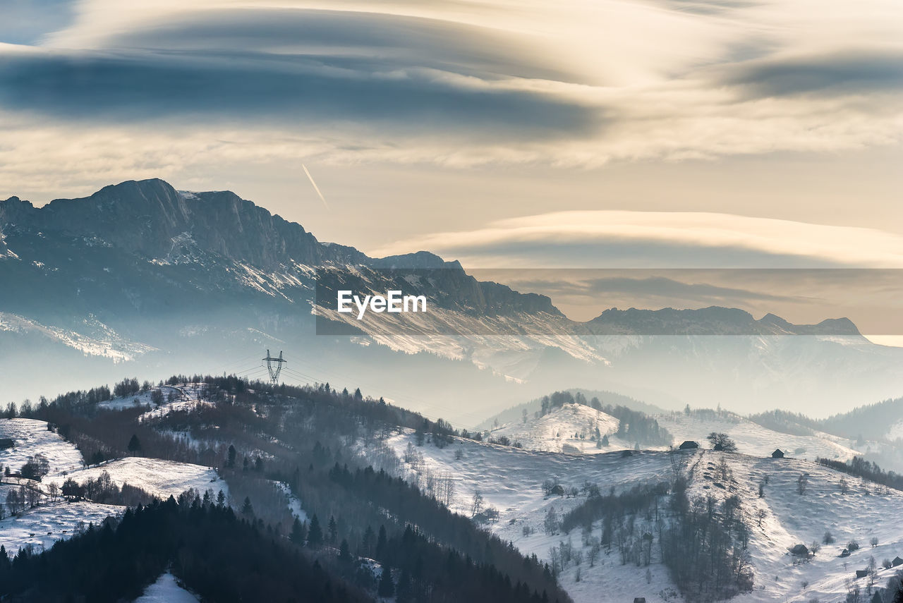 Scenic view of snowcapped mountains against sky