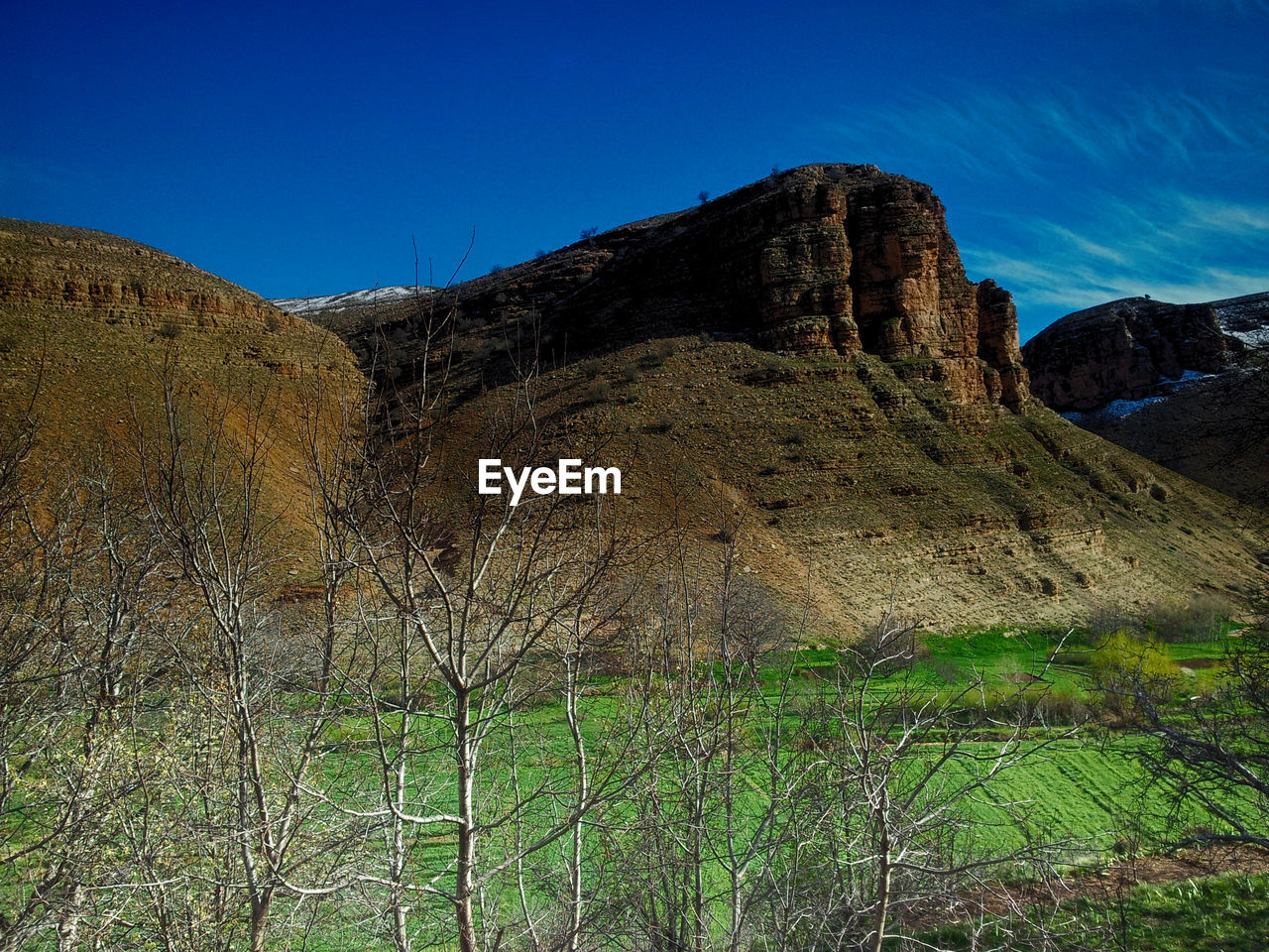 LOW ANGLE VIEW OF ROCKY MOUNTAIN AGAINST SKY