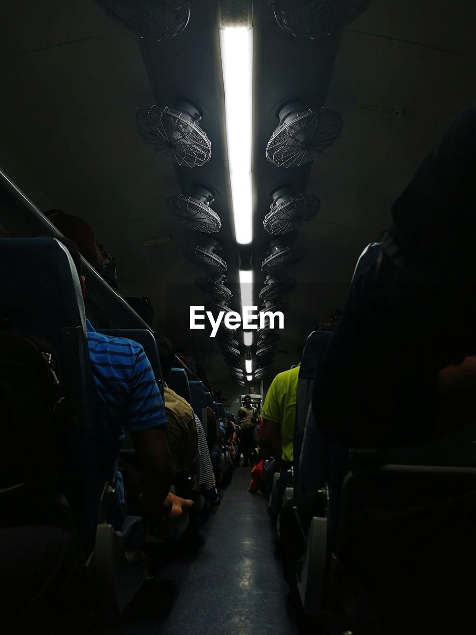 People in bus at night