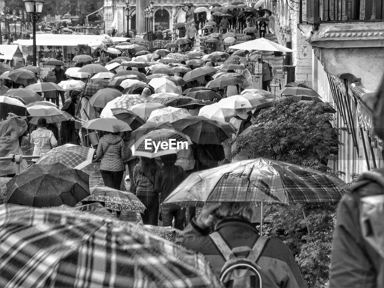 Group of people on wet street in rainy season