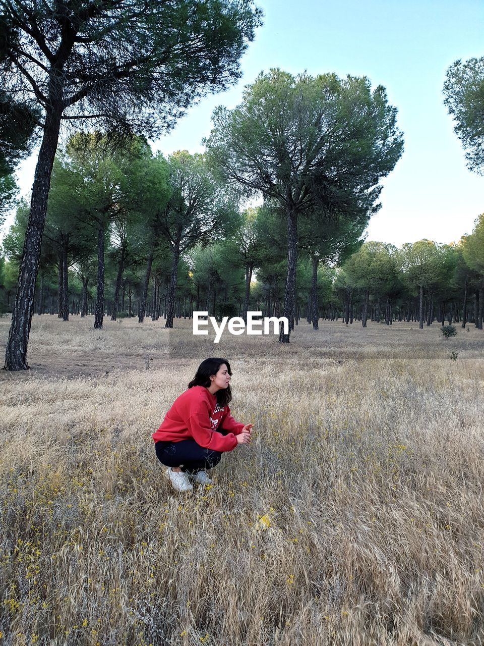 Side view of woman on field