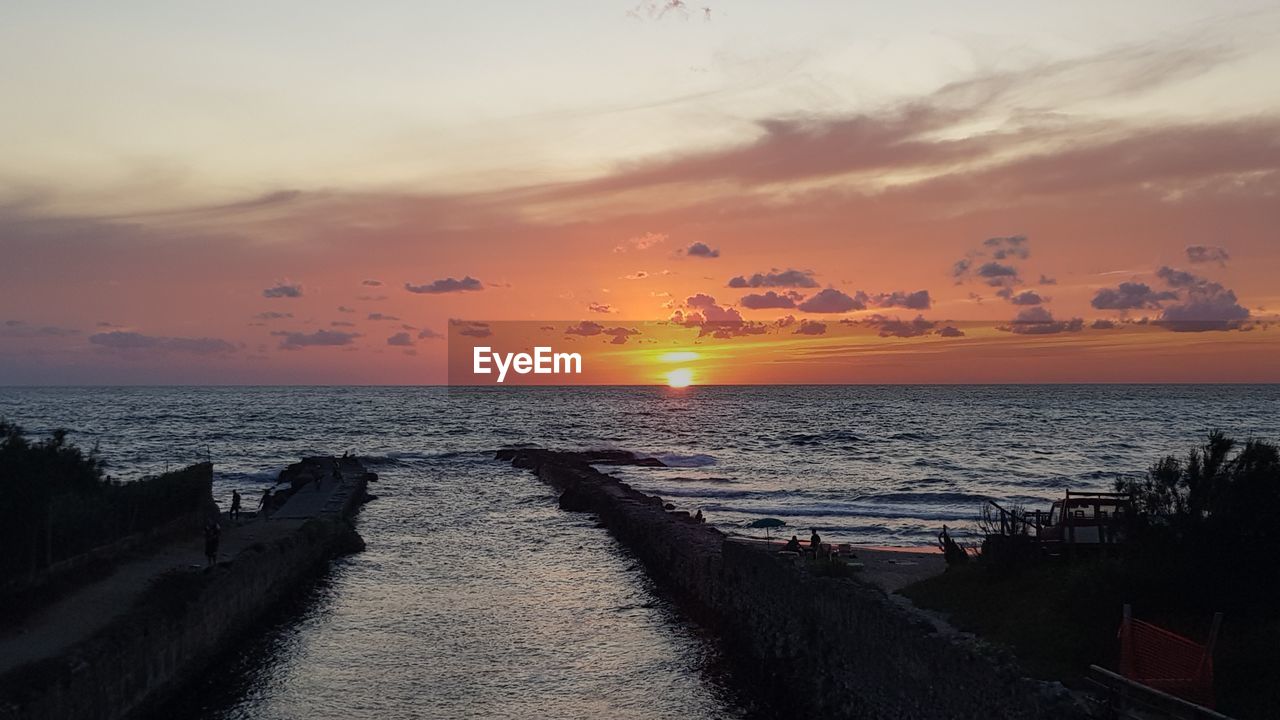 Scenic view of sea against sky during sunset