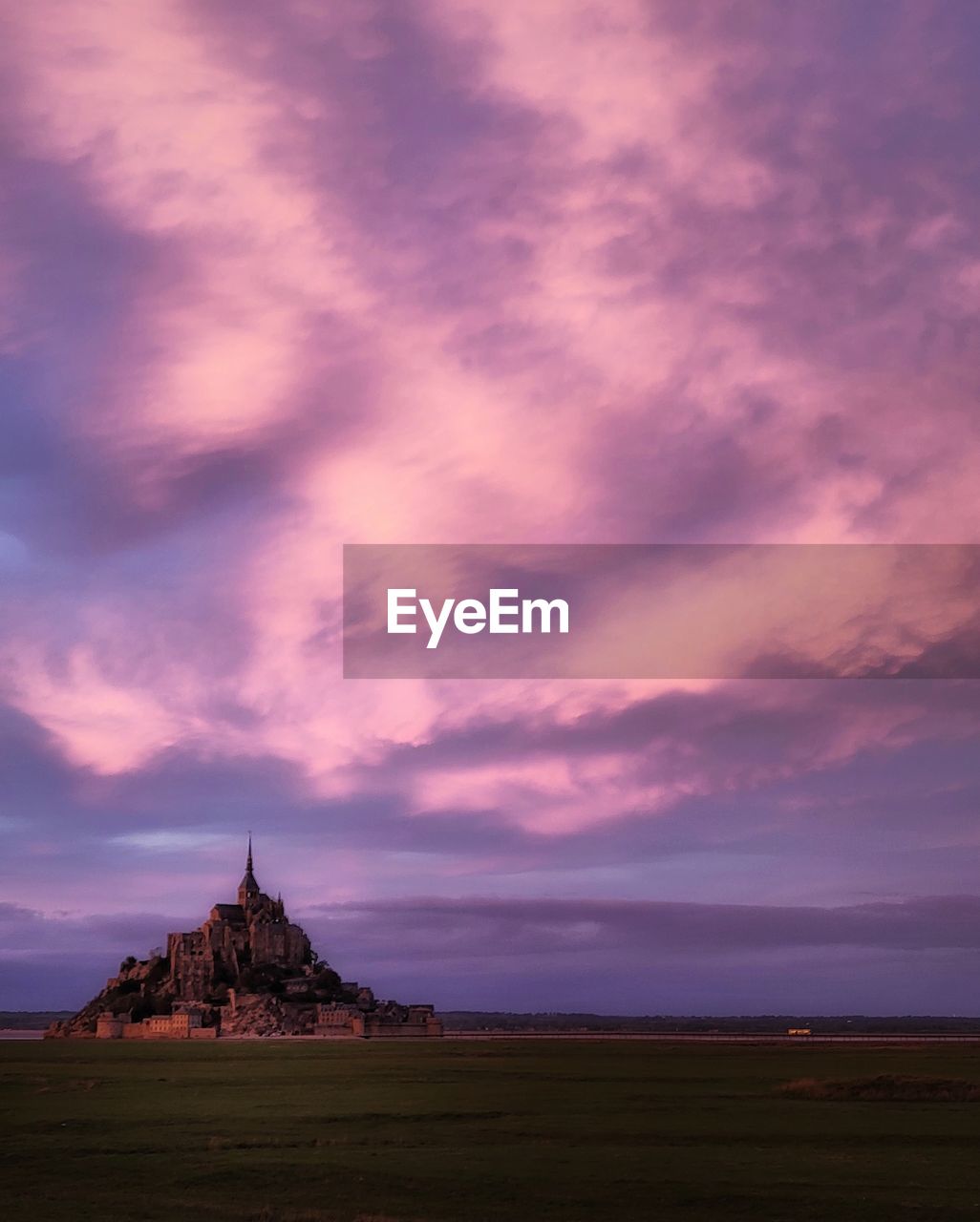Scenic view of sea against sky during sunset in le mont st. michel