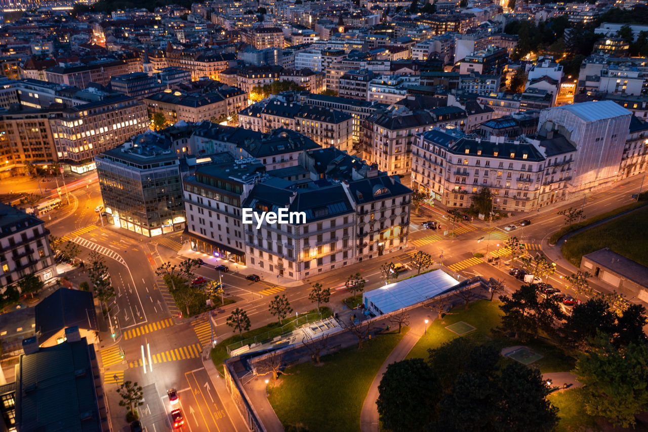 HIGH ANGLE VIEW OF ILLUMINATED CITY STREET