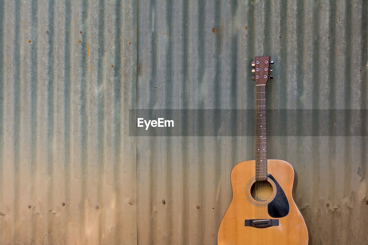 Guitar on corrugated iron