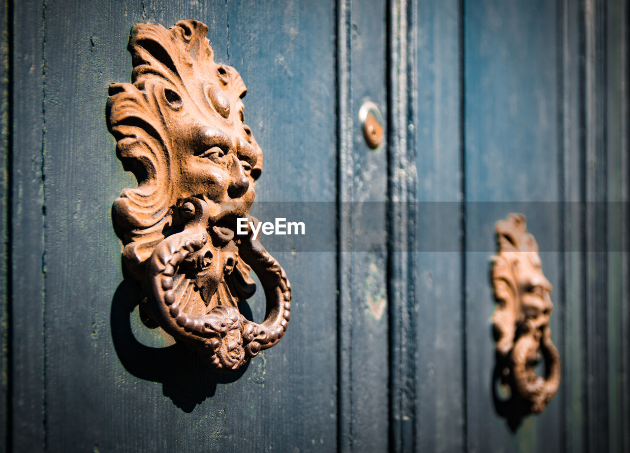 Close-up of rusty door knocker