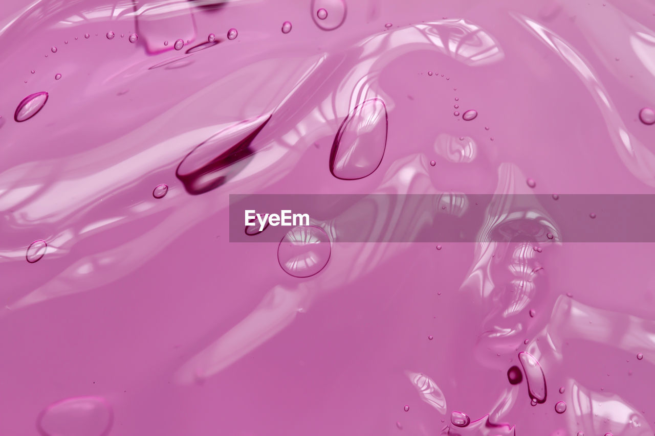 Full frame shot of wet pink paint