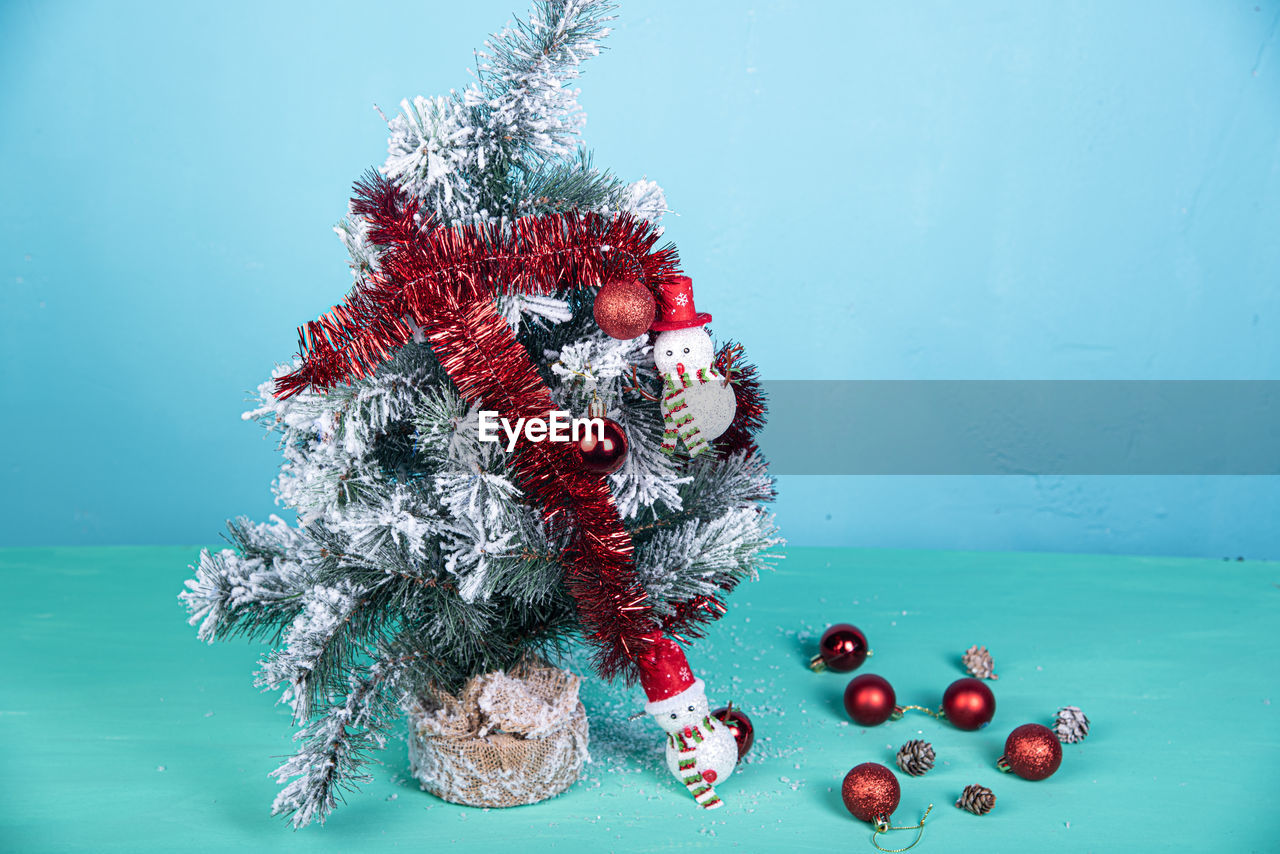 Close-up of christmas tree on blue background