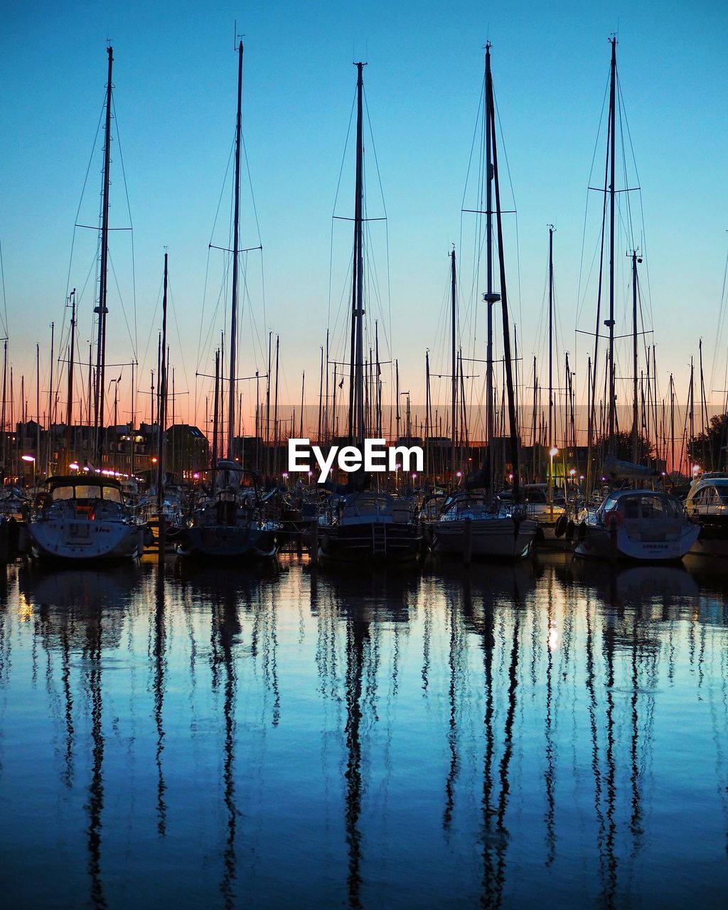 Boats moored at harbor