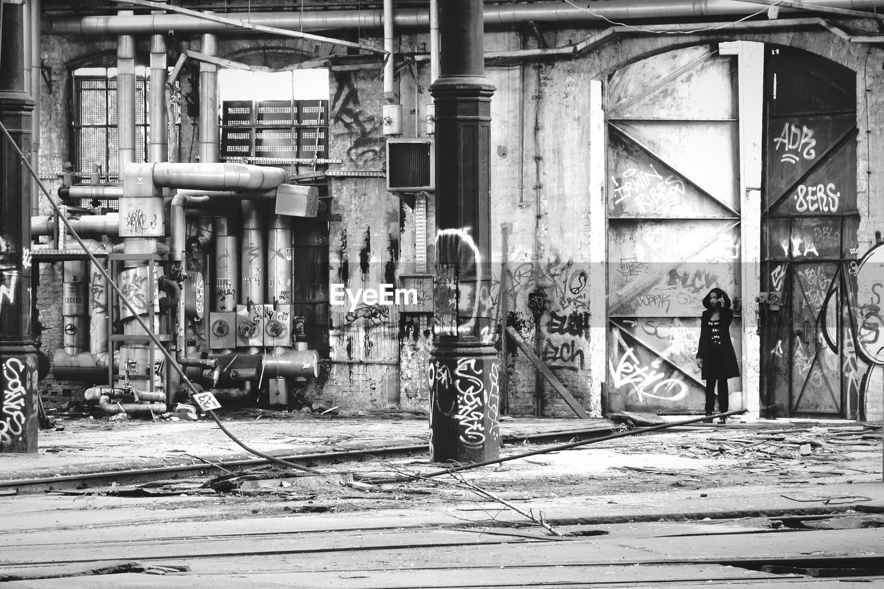 WOMAN STANDING IN CITY