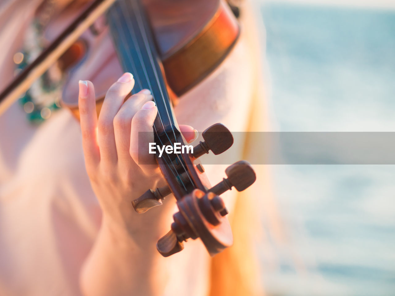 Close-up of hand playing violin