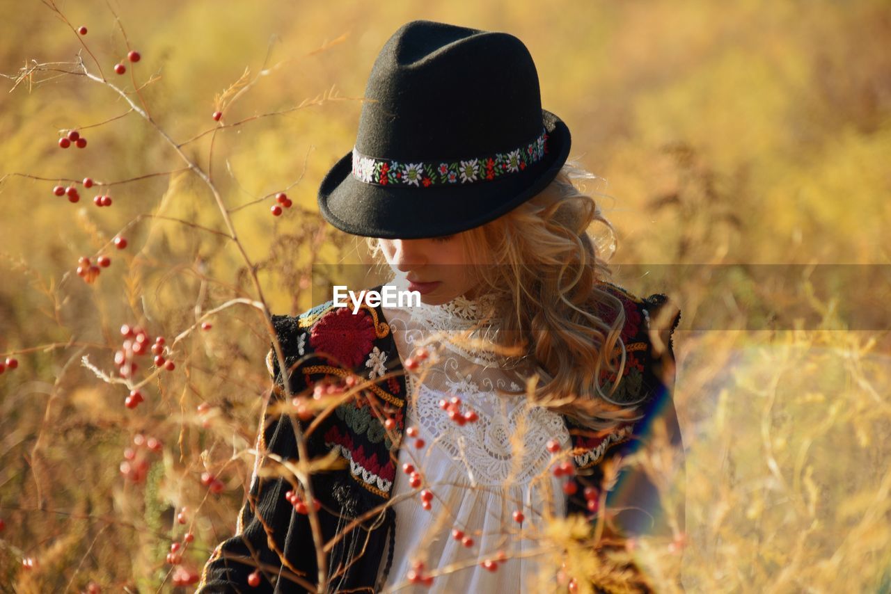 Woman wearing hat on field