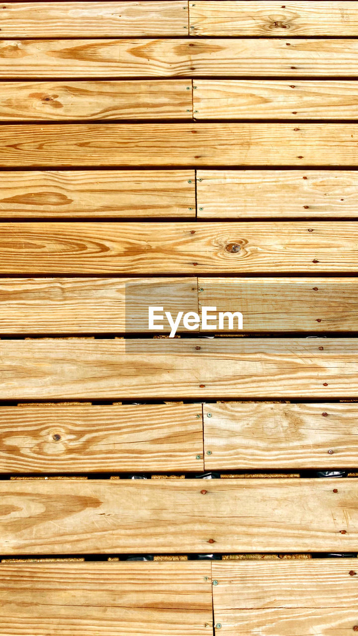 wood, backgrounds, full frame, textured, pattern, plank, wood grain, no people, flooring, brown, floor, hardwood, striped, wood flooring, hardwood floor, close-up, wood stain, wood paneling, timber, floorboard, in a row, rough, architecture, old, wall - building feature, directly above, lumber, built structure, repetition, copy space, textured effect, weathered, surface level, outdoors, abstract, wall, nature, day, material, boardwalk, knotted wood, laminate flooring