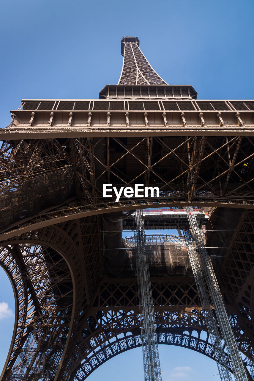 Looking up at the eiffel tower