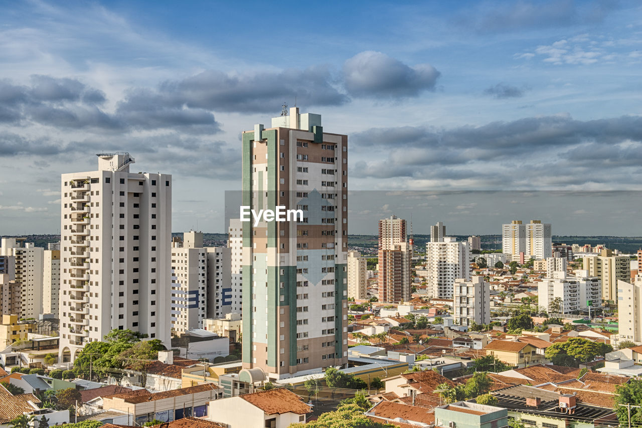 Modern buildings in city against sky