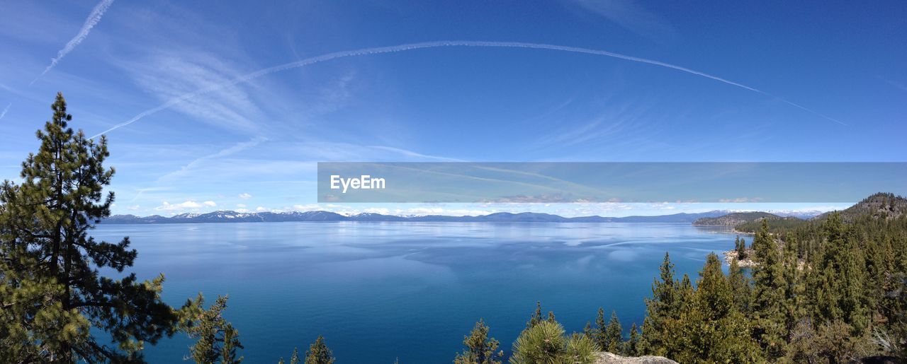 PANORAMIC VIEW OF LAKE AGAINST BLUE SKY
