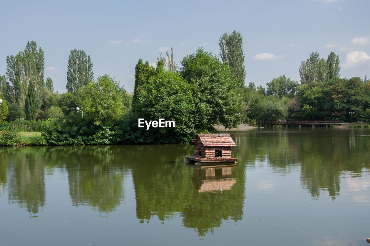 SCENIC VIEW OF LAKE AGAINST TREES