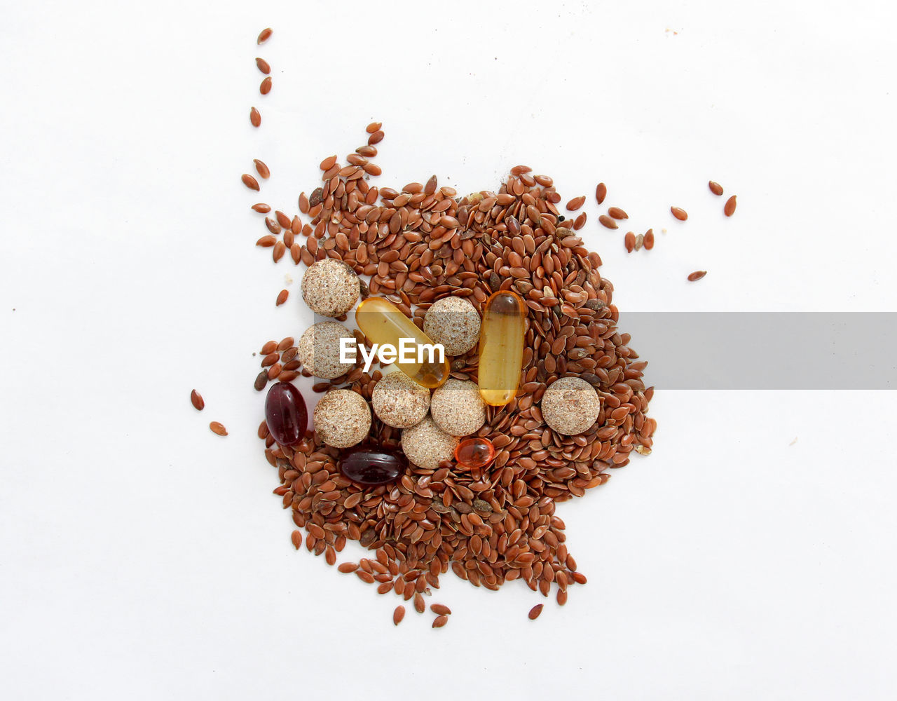 Directly above shot of food and pills over white background