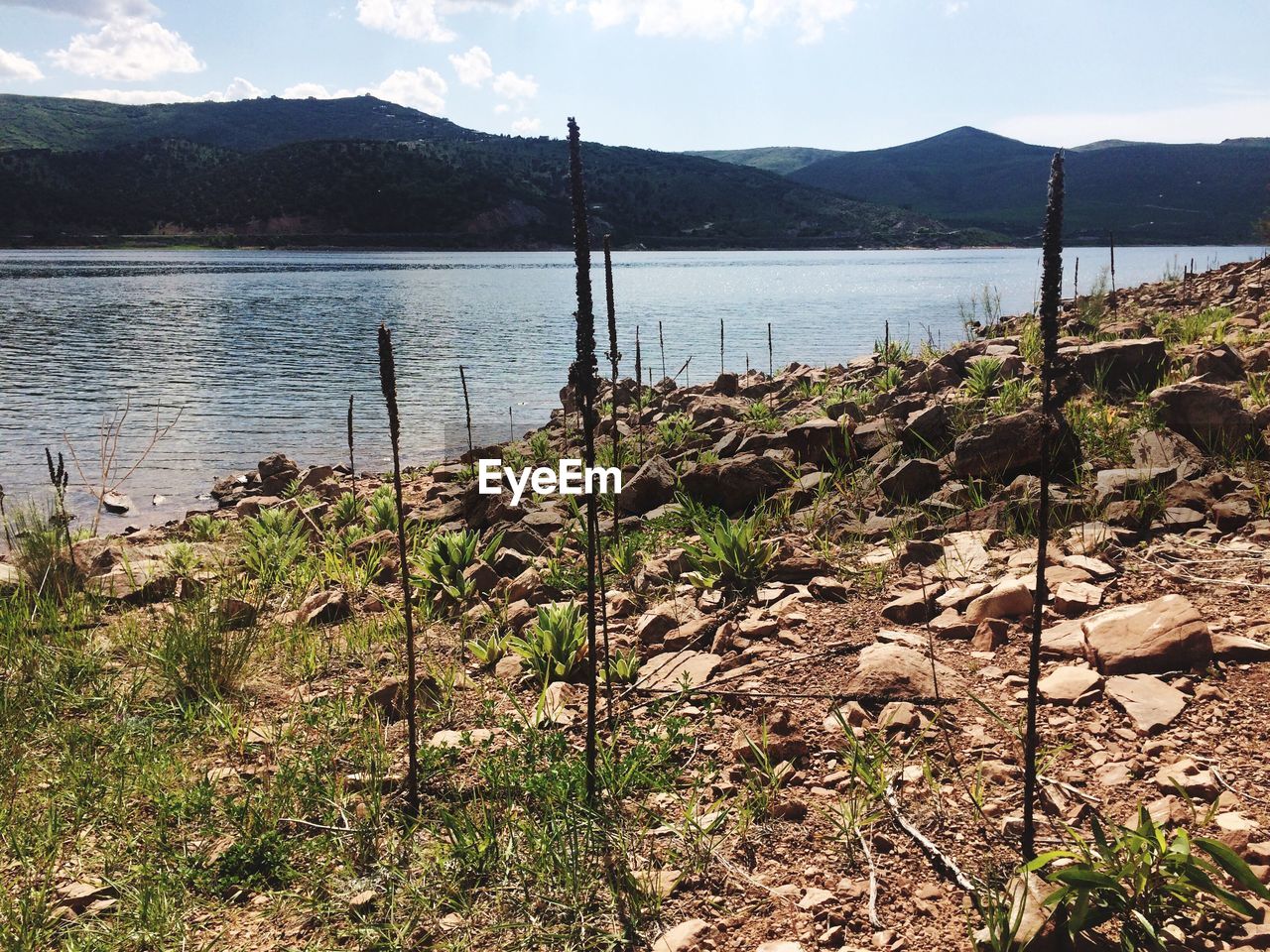 SCENIC VIEW OF LAKE AND MOUNTAINS