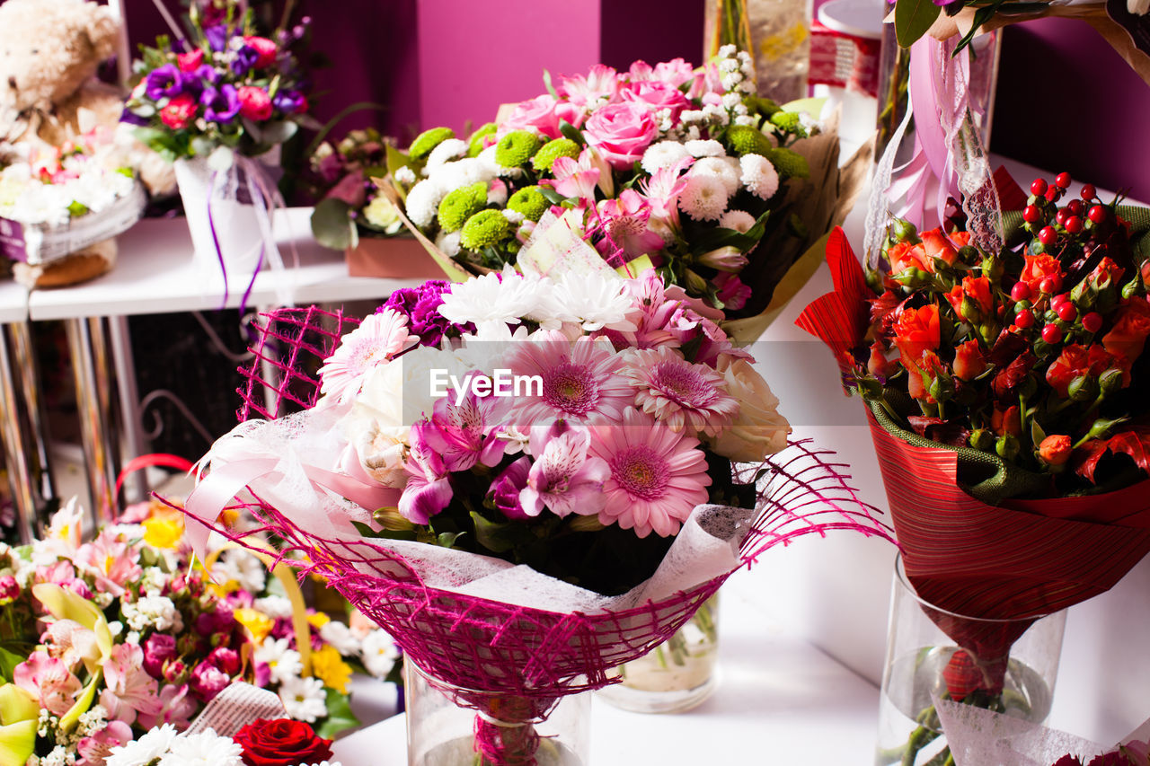 CLOSE-UP OF BOUQUET ON TABLE