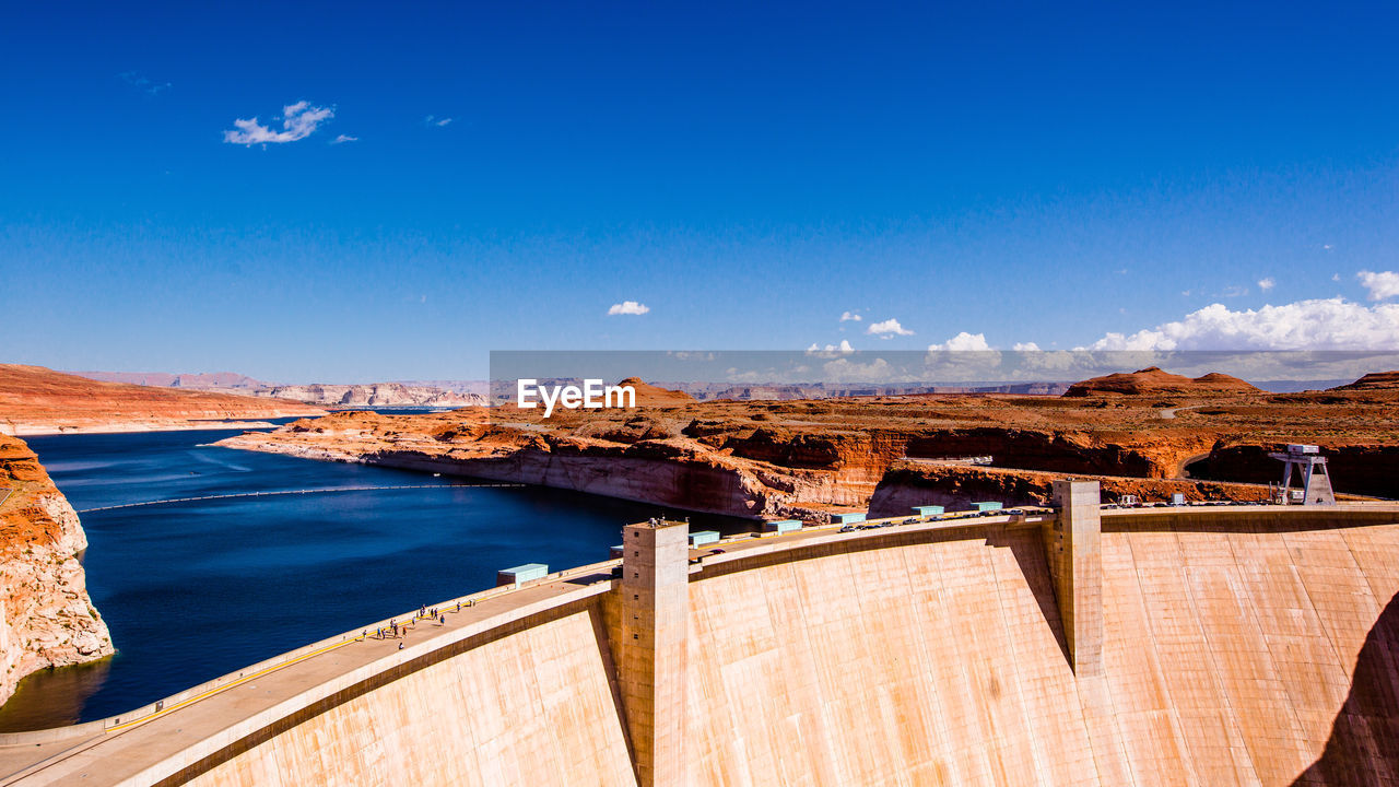 VIEW OF DAM AGAINST BLUE SKY