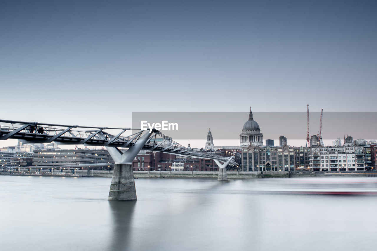 BRIDGE OVER RIVER AGAINST CLEAR SKY