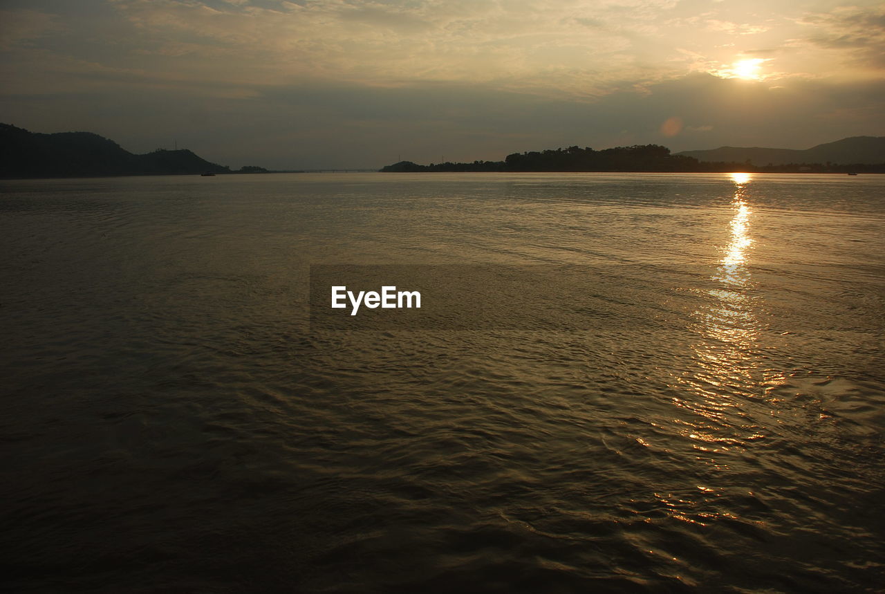 SCENIC VIEW OF SEA DURING SUNSET