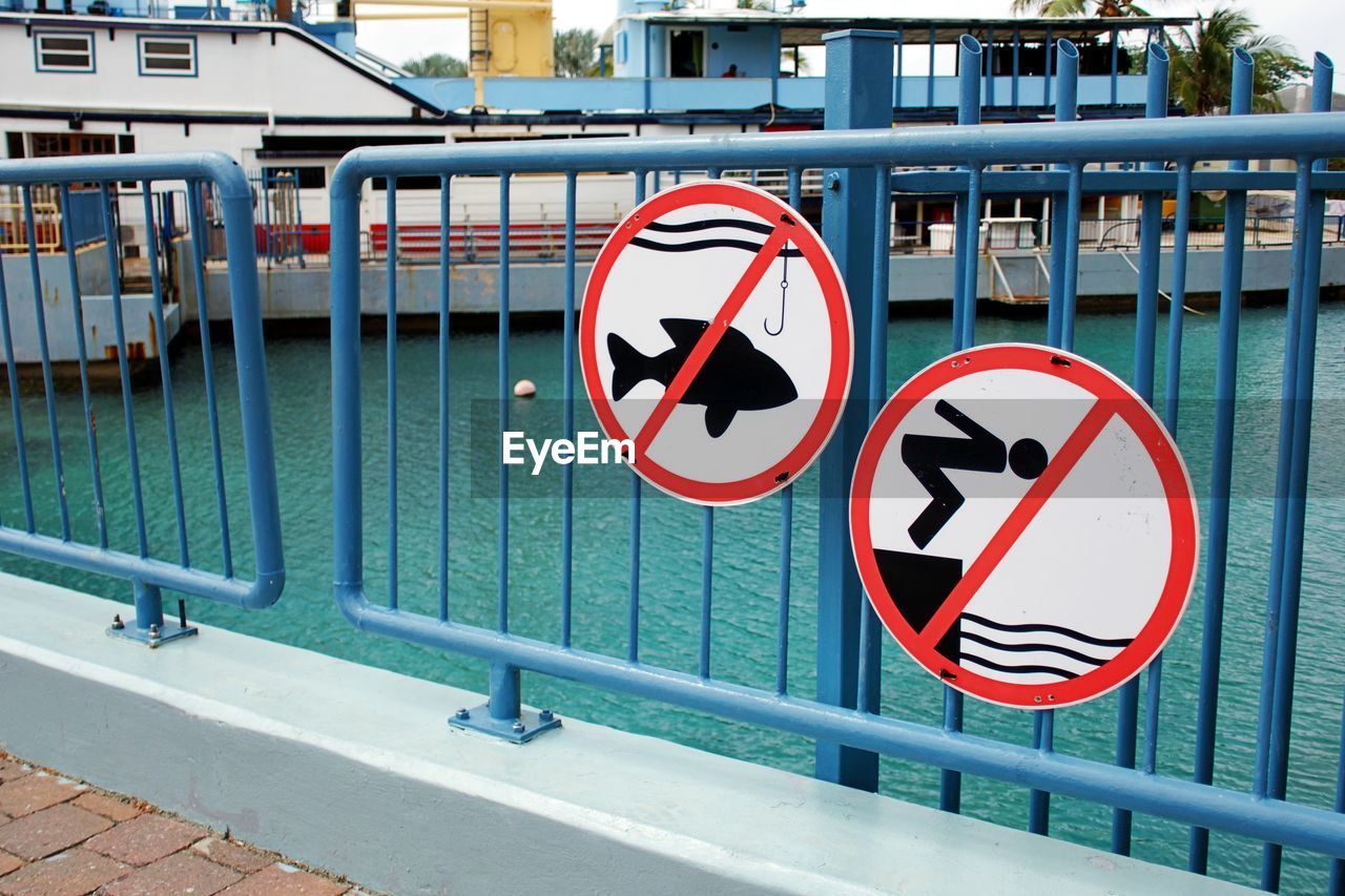 ROAD SIGN ON RAILING