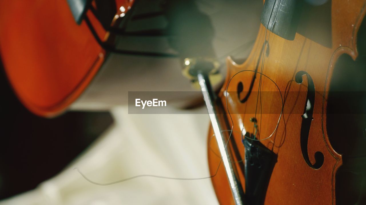 Close-up of broken violin on floor