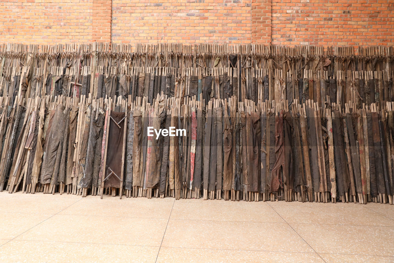 wood, floor, architecture, no people, wall, flooring, large group of objects, iron, day, hardwood, wall - building feature, abundance, built structure, outdoors, brick, building