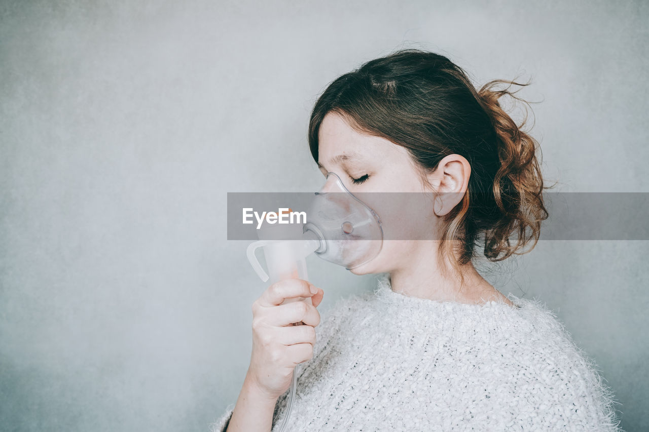 PORTRAIT OF A WOMAN DRINKING GLASS