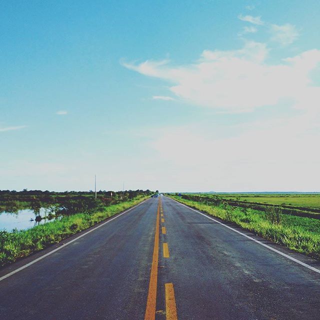 EMPTY ROAD PASSING THROUGH LANDSCAPE