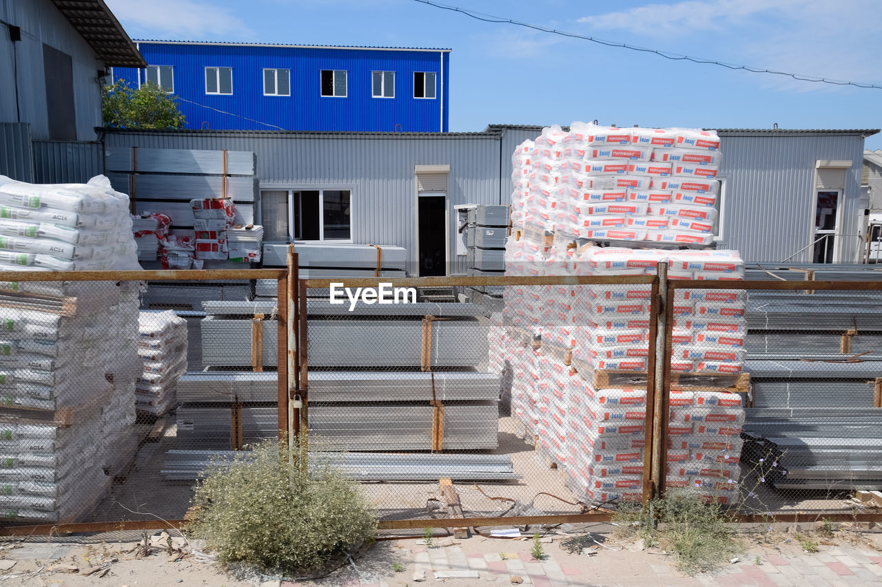 STACK OF HOUSE AGAINST BUILDINGS