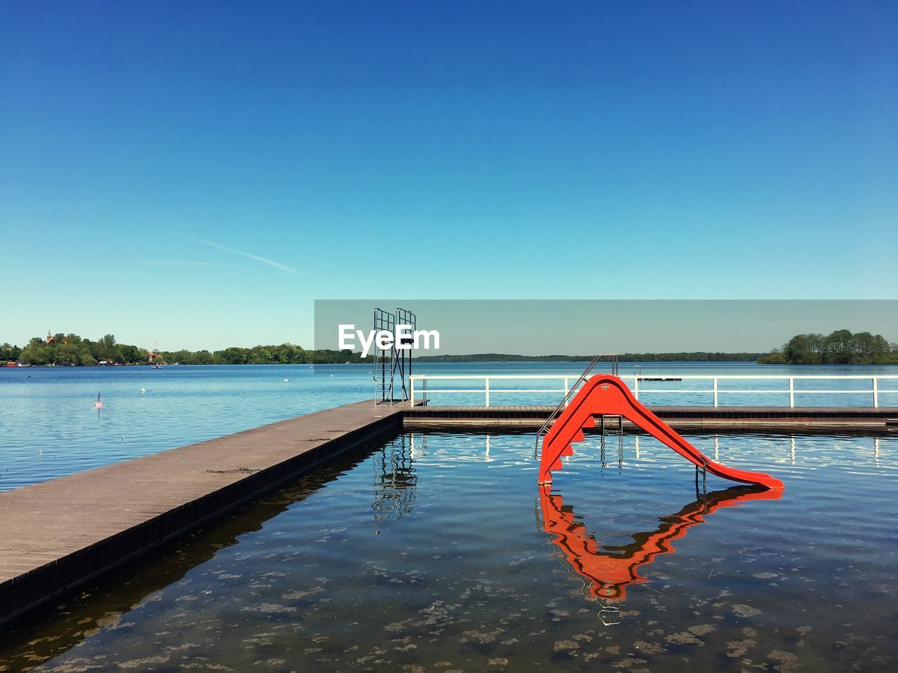 VIEW OF SWIMMING POOL AGAINST BLUE SKY