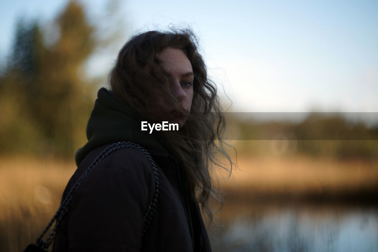 side view of young woman looking away