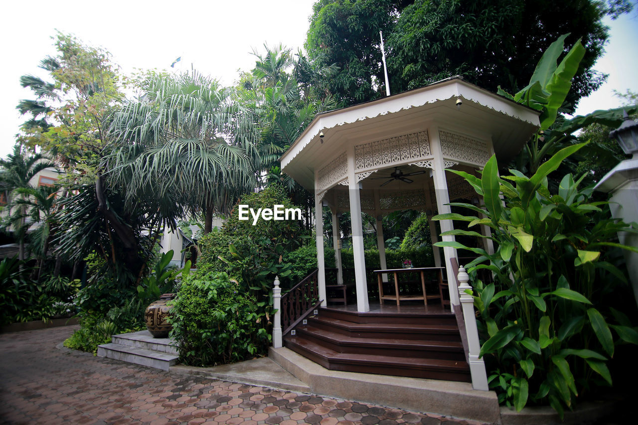 EXTERIOR OF BUILDING BY TREES