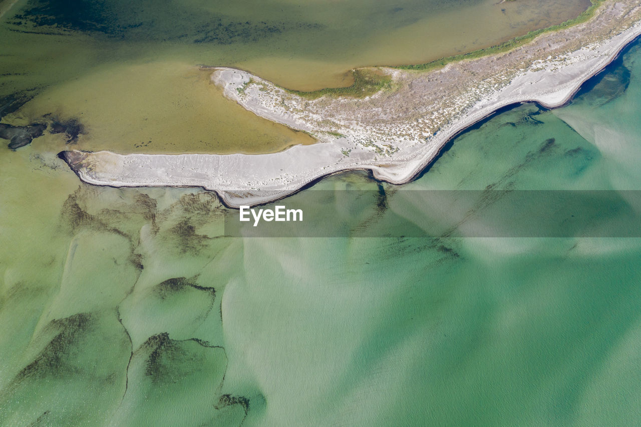 Aerial view on shapes and pattern of marshland into shallow waters in baltic sea on northshore 