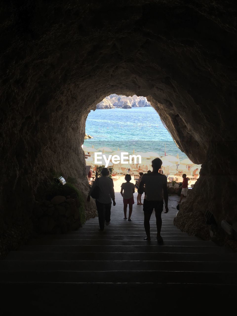 VIEW OF SILHOUETTE PEOPLE IN TUNNEL