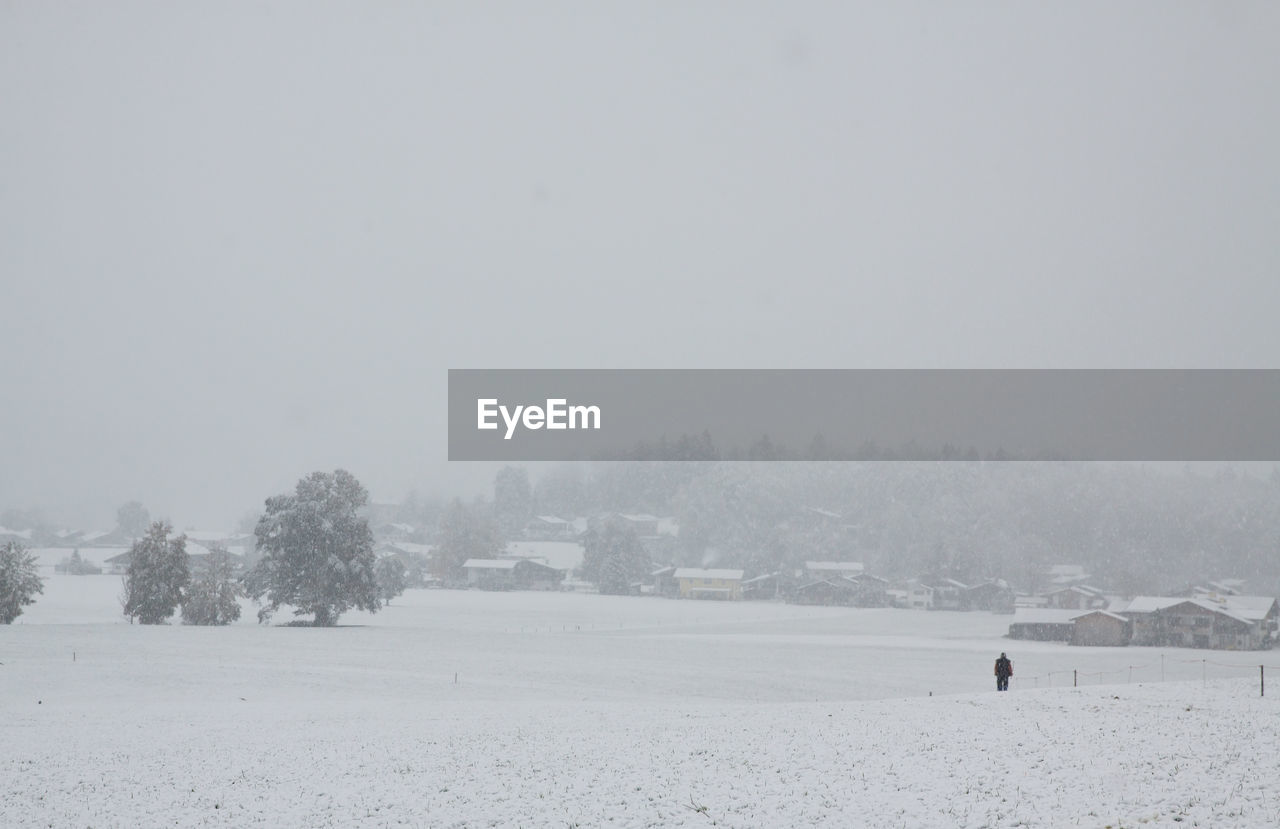 Scenic view of landscape against sky during winter