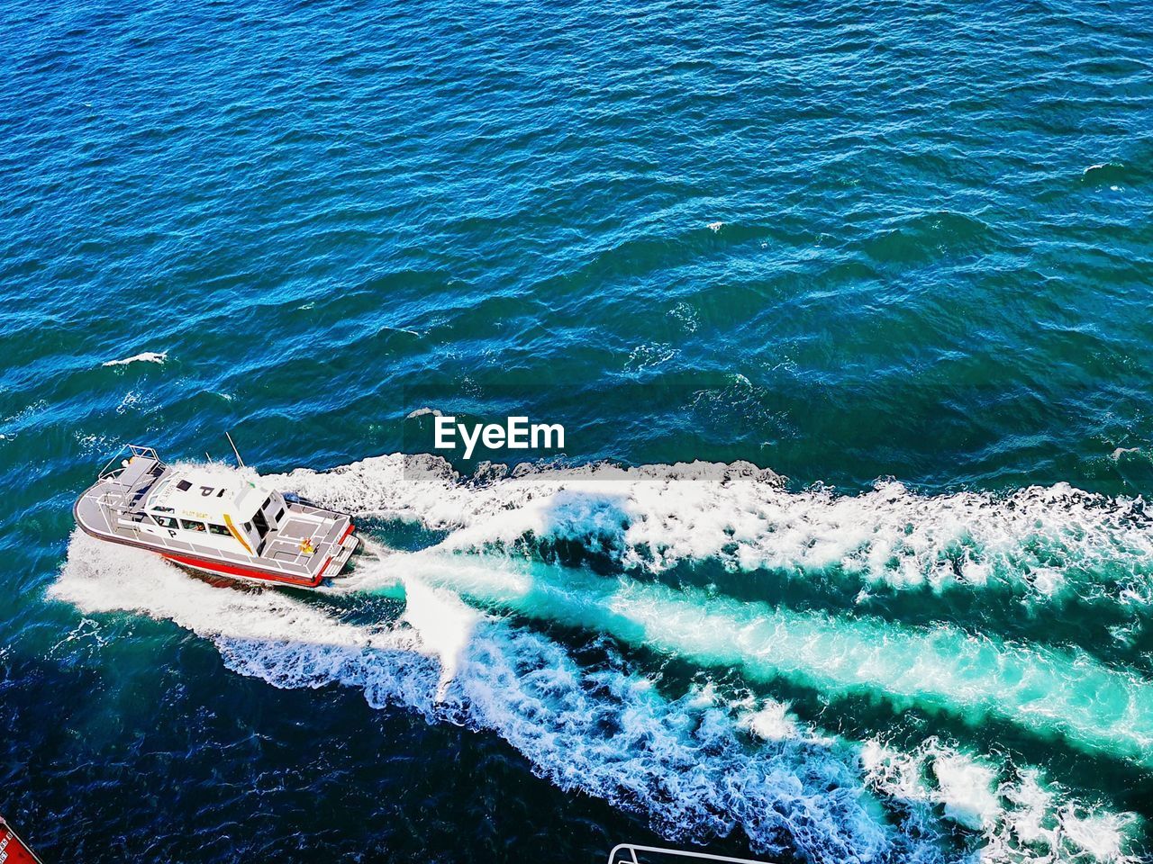 HIGH ANGLE VIEW OF NAUTICAL VESSEL IN SEA