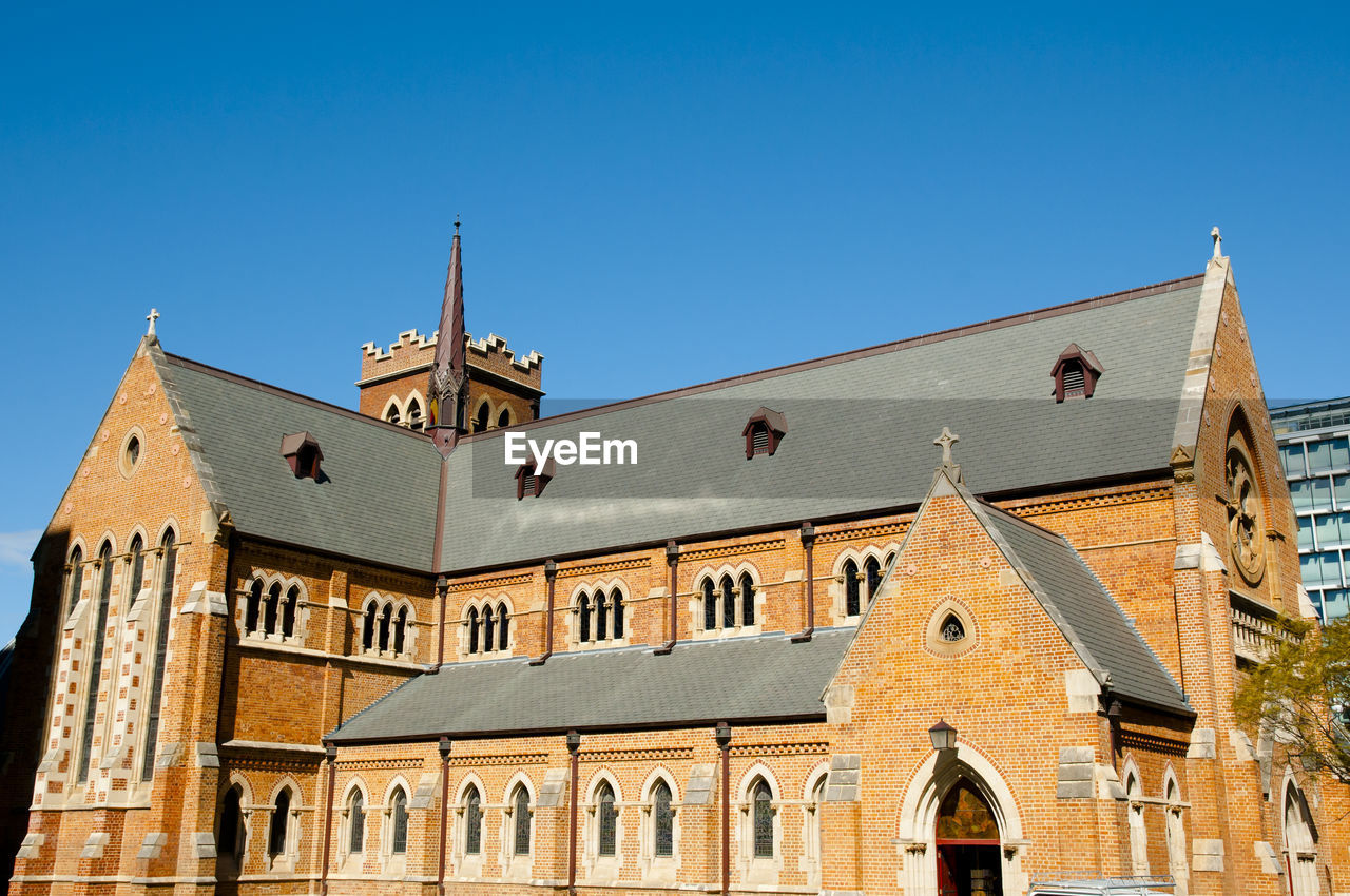 LOW ANGLE VIEW OF CHURCH AGAINST CLEAR BLUE SKY