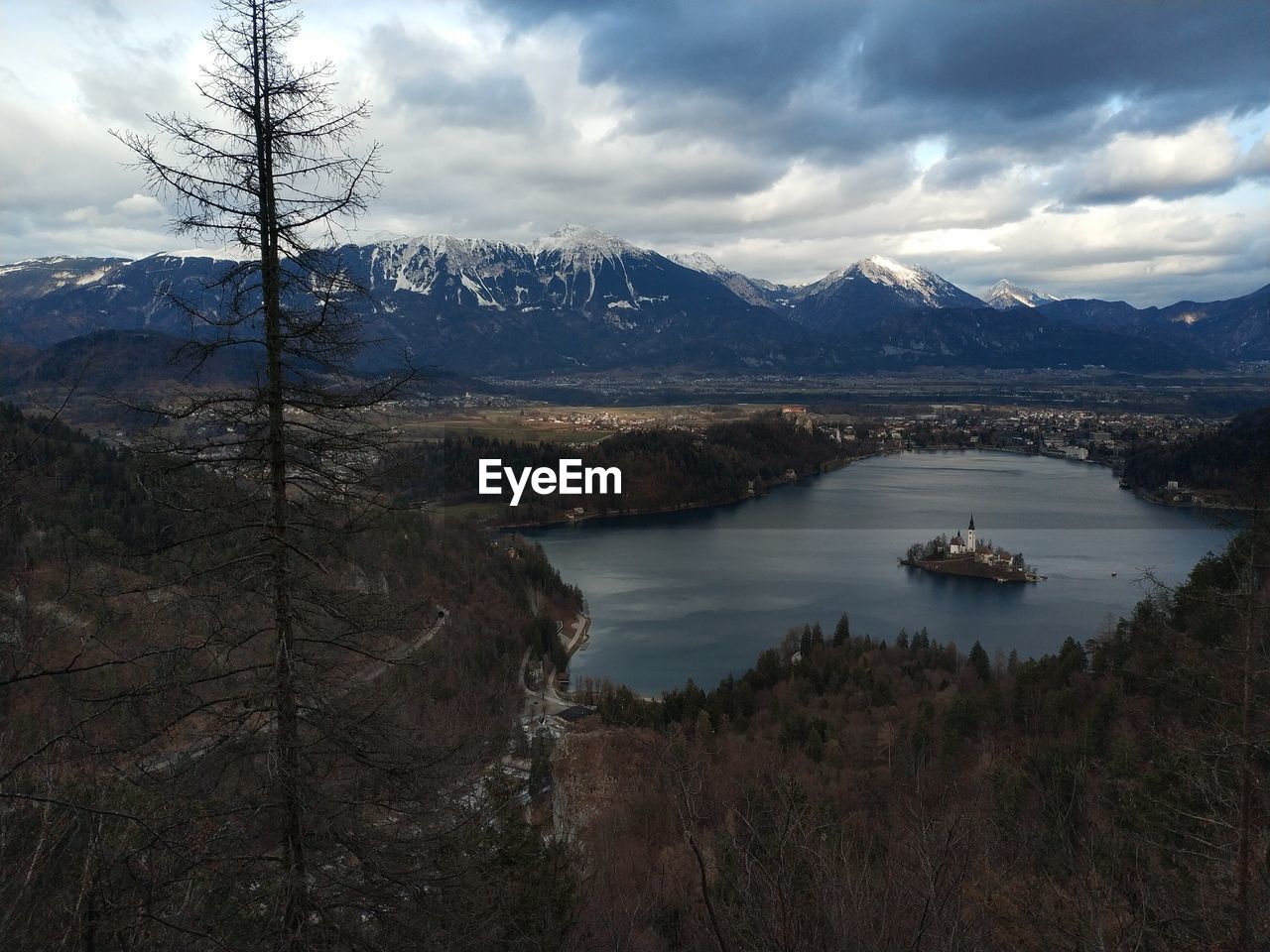 Scenic view of lake and mountains against sky